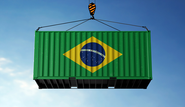 Brazil and Tarriffs:  Brazil trade cargo container hanging against clouds background