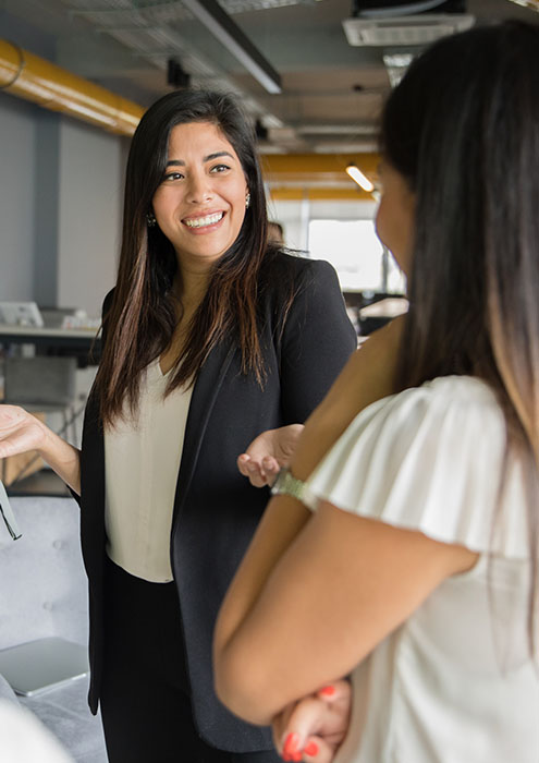 Two women talking in an office