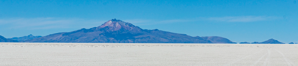 The Uyuni salt flat with a mountain on the horizon