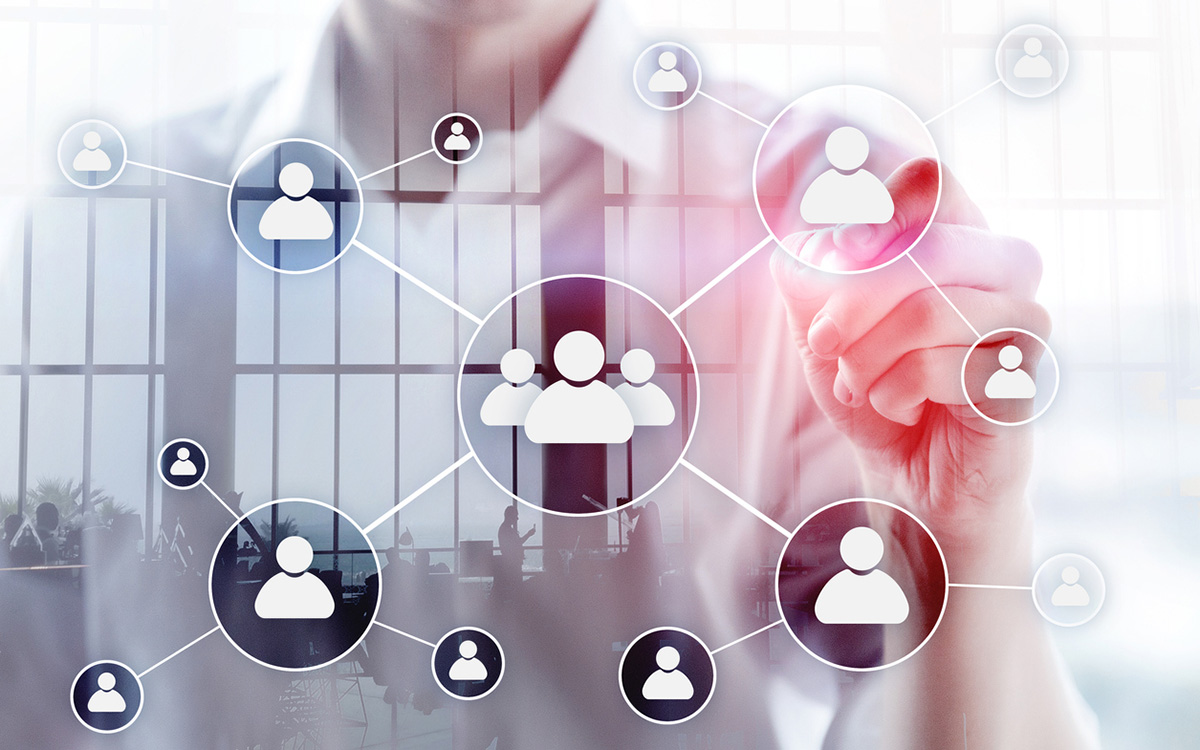 A hand connecting a network of stakeholder icons