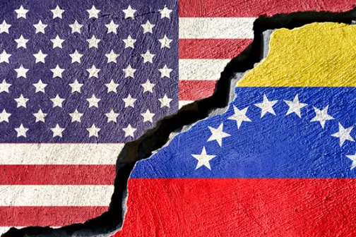 US and Venezuelan flags separated with a jagged tear