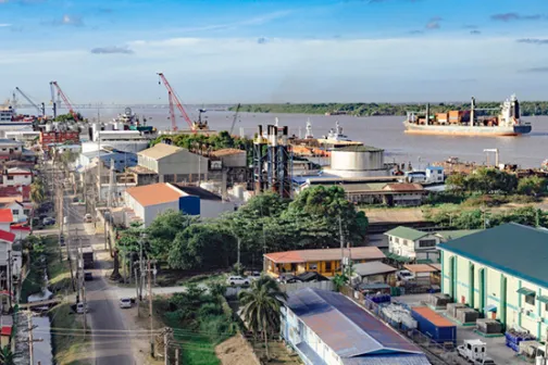 Aerial view of Georgetown, Guyana with a river port and cargo ship