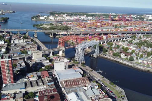 Aerial view of Buenos Aires with river bridges and a shipping port
